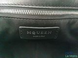 a close up of a black bag with a zipper on it