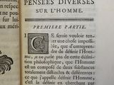 an open book with a picture of a rooster on it