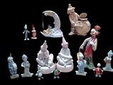 many figurines of different shapes and sizes on a black background