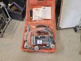 a tool kit sitting in a case on the floor