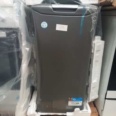 an image of a refrigerator sitting on top of a pallet next to a stack of other appliances