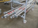 a large metal rack with pipes on it in a building