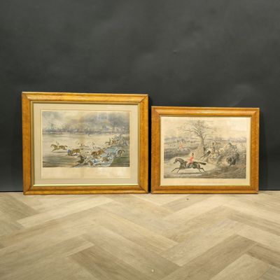 two framed prints of horses and jockeys racing on a track