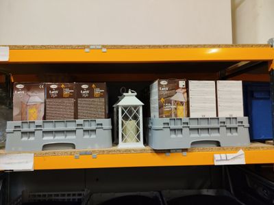 a shelf with a lantern on it in a store