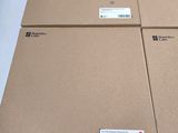 three boxes are stacked on top of each other on a table