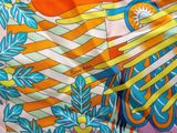 an image of a close up of a colorful scarf with a bird on it