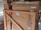 a large pile of cardboard sitting on top of a pallet