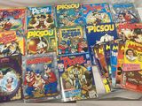 a lot of comic books on the bed