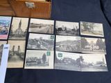 a lot of old postcards that are on the table