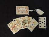 several playing cards are laid out on a black surface