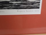 a picture of a black and white picture on a red wall