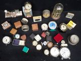 many different types of watches on a black table
