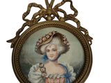 une image représentant un tableau où l'on voit une femme portant un chapeau
