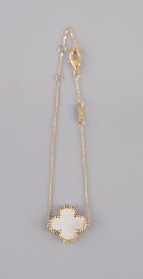 a gold plated necklace with a white druzy stone