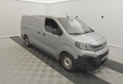 the van is parked in the garage on the checkered floor