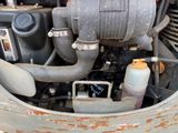 a close up view of an old engine in the back of a truck