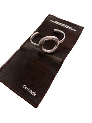 a pair of scissors in a pouch on a white background