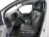 the interior of a white truck with black leather seats and a steering wheel
