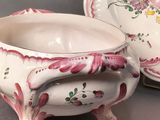 a white bowl and saucer sitting next to each other
