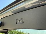 a close up of a car ' s door handle with a window open