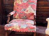 two chairs that are sitting in front of a wooden door