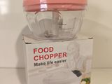 a pink food chopperper sitting on top of a box