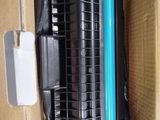 a black and blue toner in a cardboard box