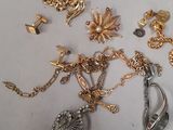 a lot of gold and silver jewelry on a table