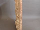 a bird that is sitting on top of a piece of wood