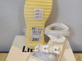 a box with a pair of baby shoes on it