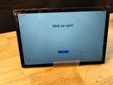 a laptop with a message on it sitting on a table