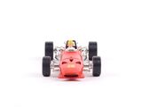 a red toy car that is sitting on a white surface