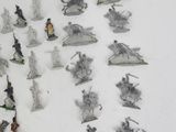 a lot of toy figurines that are on the table