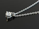 a silver chain with a heart shaped pendant on it