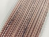 a package of copper colored metal straws in a plastic container