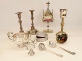 a lot of silver objects on a white table