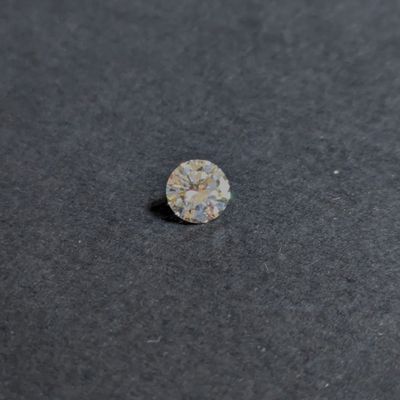 a single diamond on a black surface