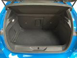 a trunk of a blue car with its doors open