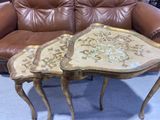 two tables that are sitting next to each other on a couch