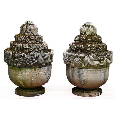 two vases that have moss growing on them