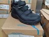 a pair of shoes that are on top of a box
