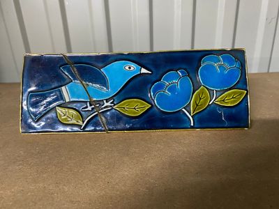 blue bird on a branch with blue flowers on a blue background