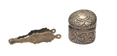 a small silver box and a small silver object