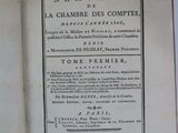 an open book on a white table with a black and white title
