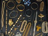 many different types of jewelry on display in this case