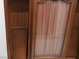 pair of antique french style armoires with glass doors