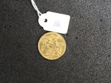 a gold coin with a price tag attached to it
