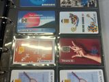 many credit cards in a binder on a table