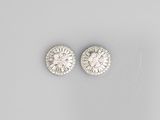a pair of diamond and white gold earrings