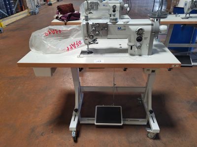 a sewing machine that is sitting on a table